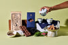 Tea packaging and tea-making setup on a green background